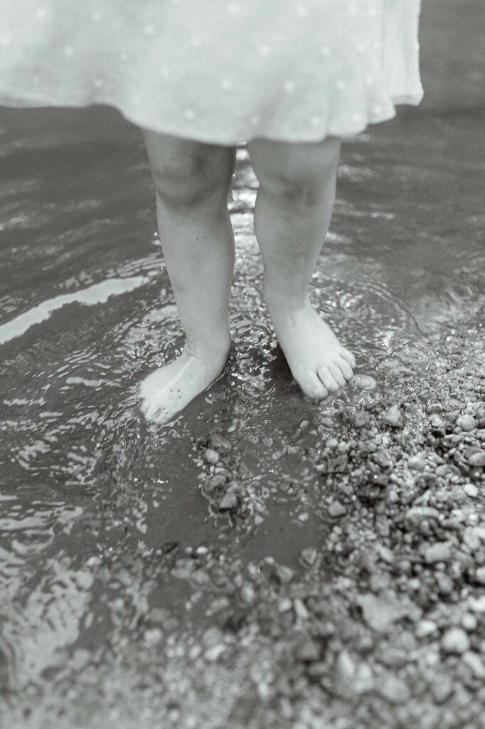 A close up of a little girl's feet in the water at Turtle River State Park 