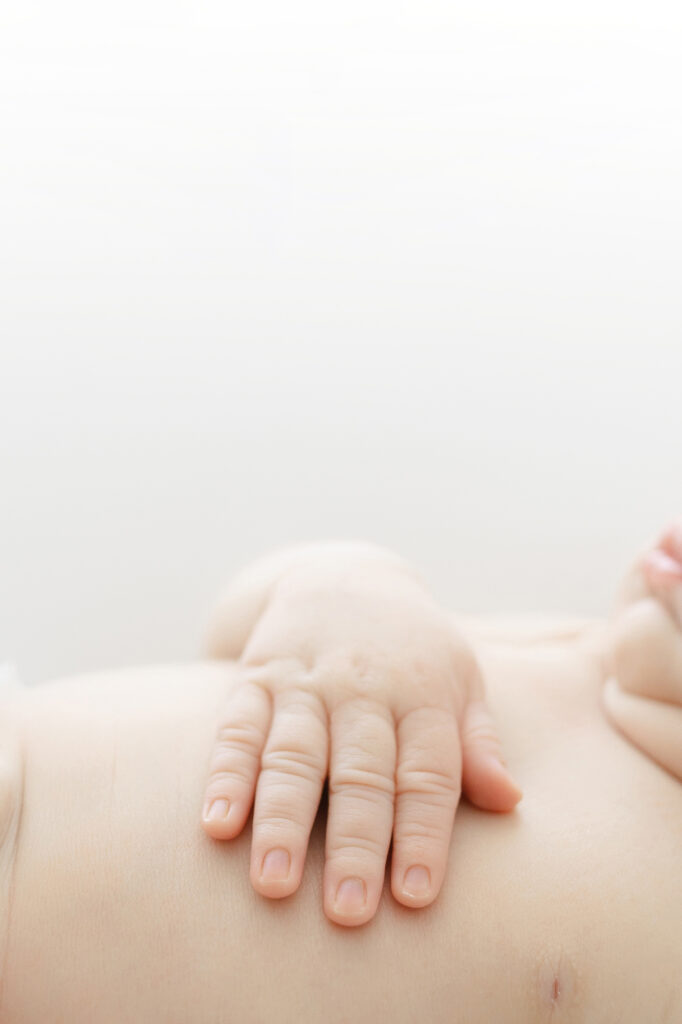 A detail image of a newborn baby's hand.