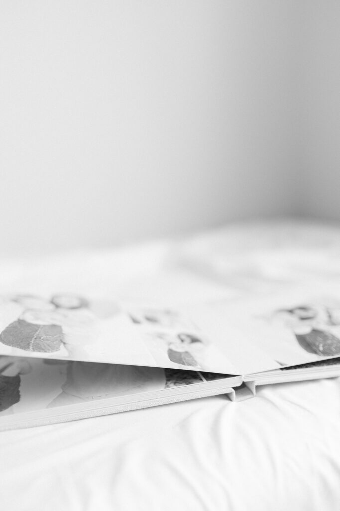 A photo album laying opened showing photography Grand Forks ND. 